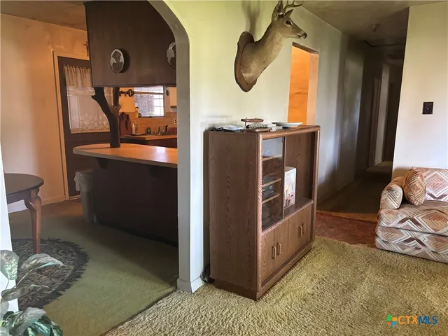 a kitchen with stainless steel appliances granite countertop a stove and a microwave
