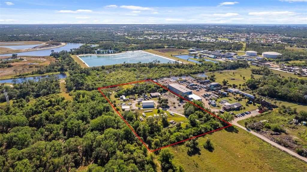 3530 Laurel Road East, Unit A North Venice, FL 34275 - Photo 2 of 17 an aerial view of residential building with parking space