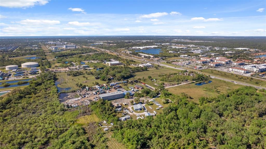 3530 Laurel Road East, Unit A North Venice, FL 34275 - Photo 6 of 17 an aerial view of residential building with green space