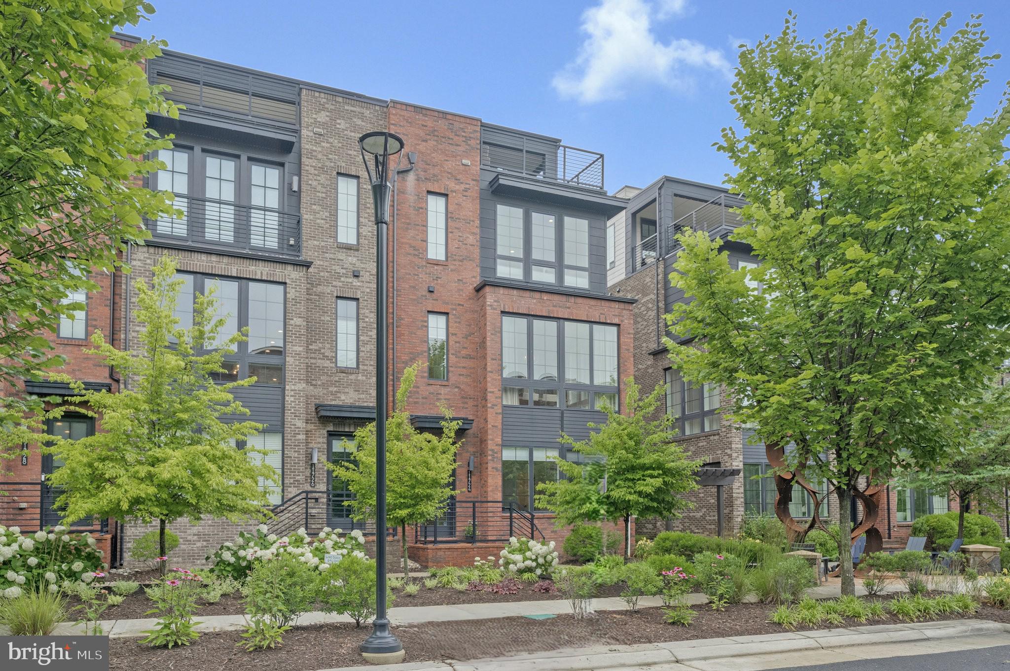 a front view of a building with garden