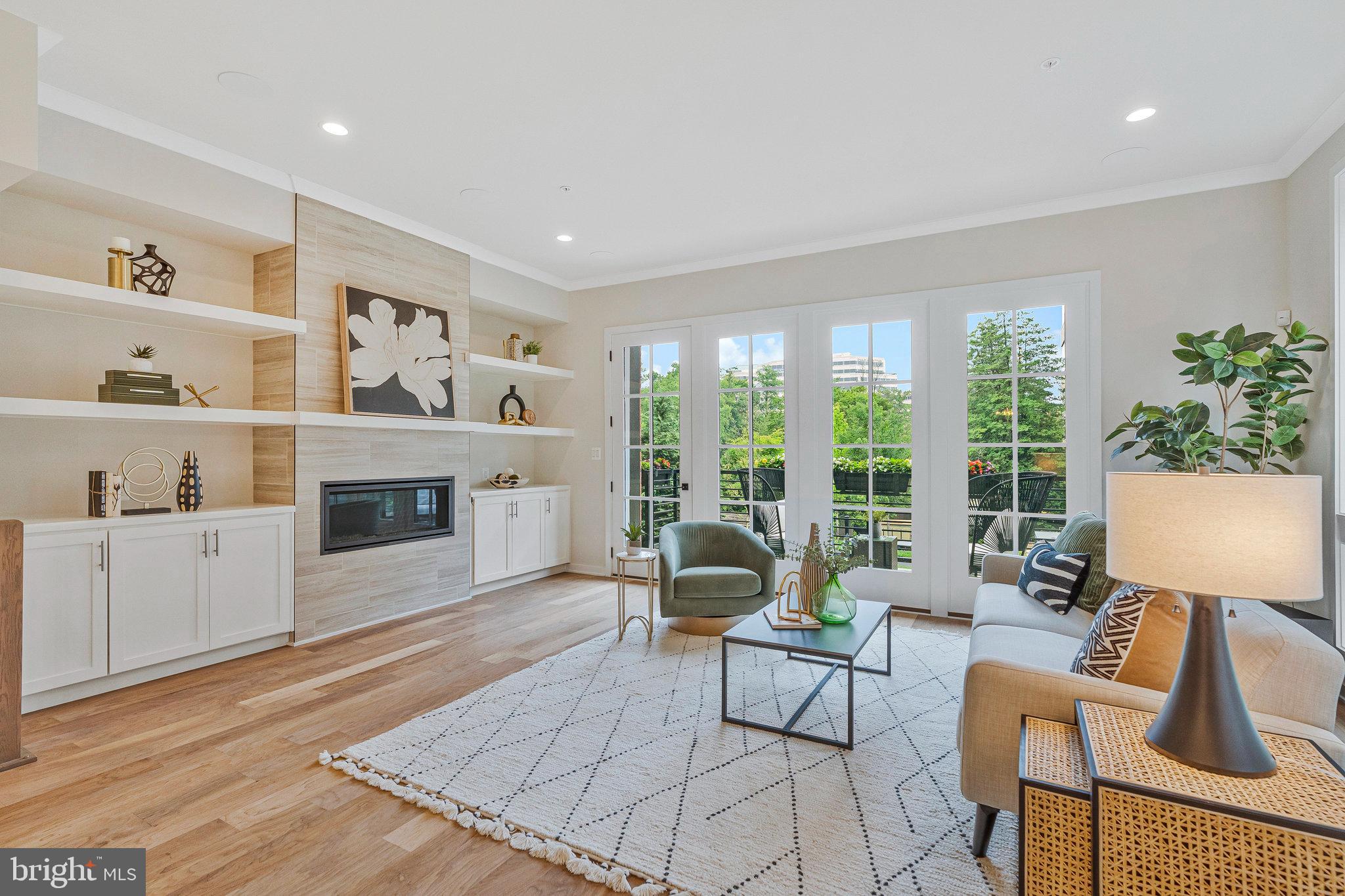 11724 Paysons Way Reston, VA 20191 - Photo 15 of 41 a living room with furniture a fireplace and a table