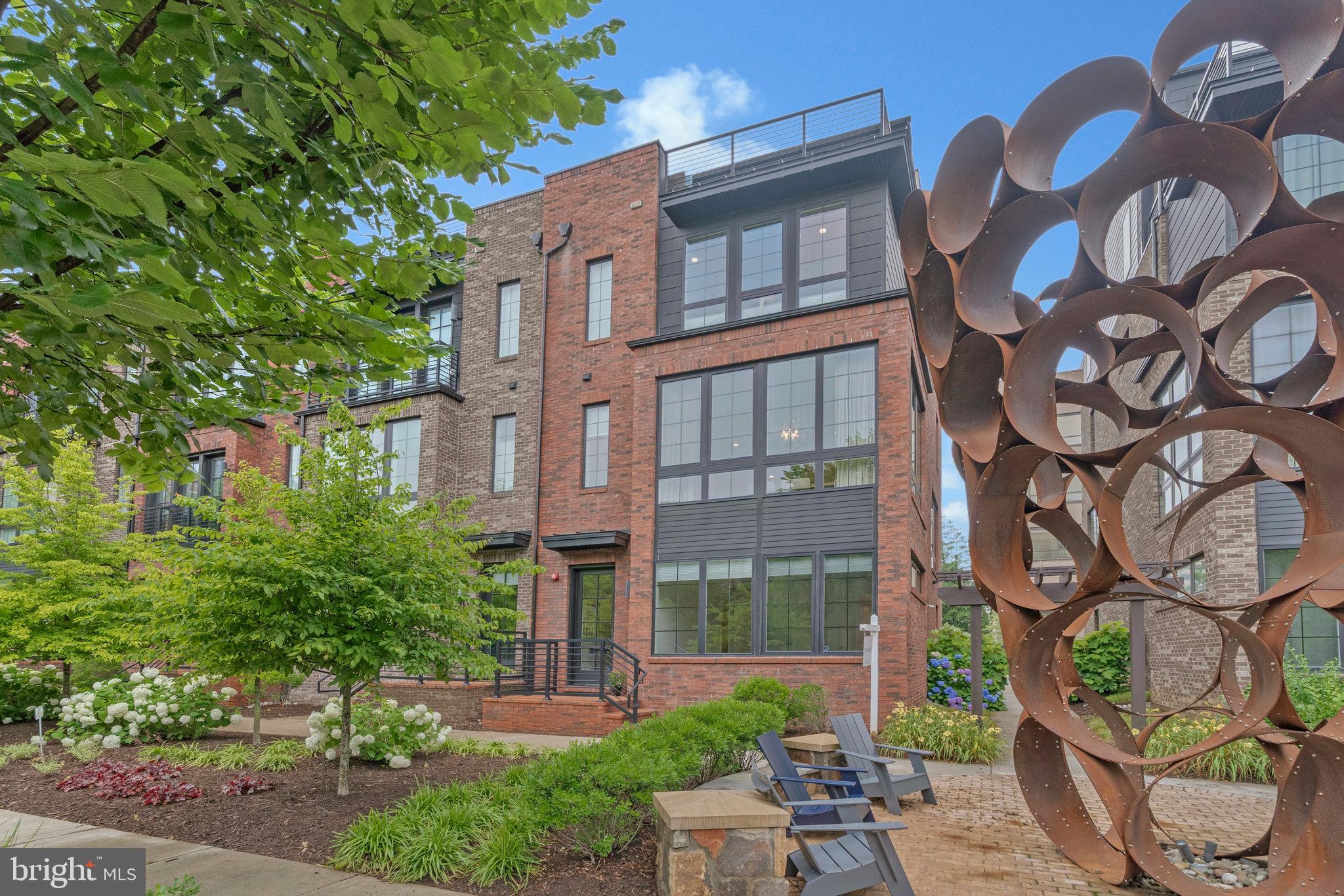 11724 Paysons Way Reston, VA 20191 - Photo 2 of 41 front view of a brick house with a yard