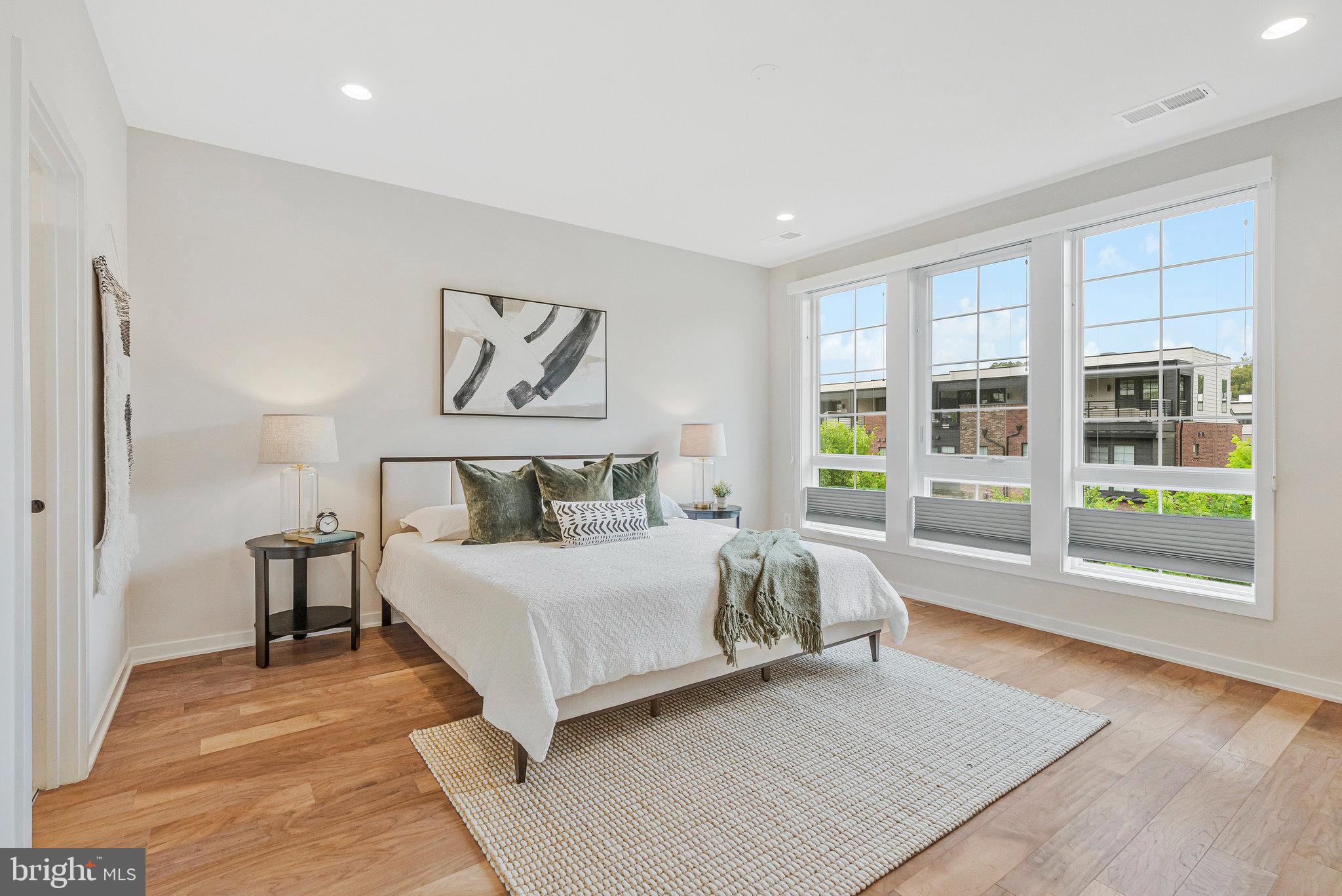 11724 Paysons Way Reston, VA 20191 - Photo 24 of 41 a bedroom with a large bed and a large window