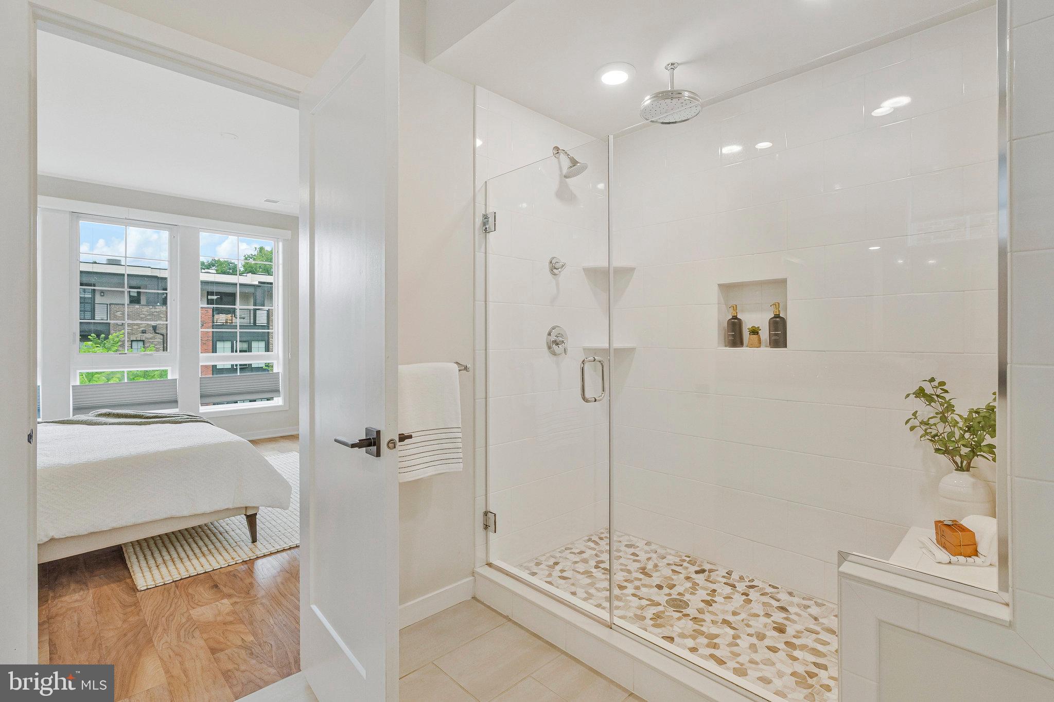 11724 Paysons Way Reston, VA 20191 - Photo 26 of 41 a bathroom with a tub shower and window