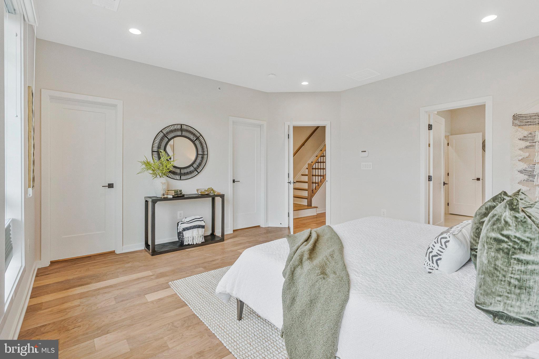 11724 Paysons Way Reston, VA 20191 - Photo 30 of 41 a bedroom with a bed and a closet