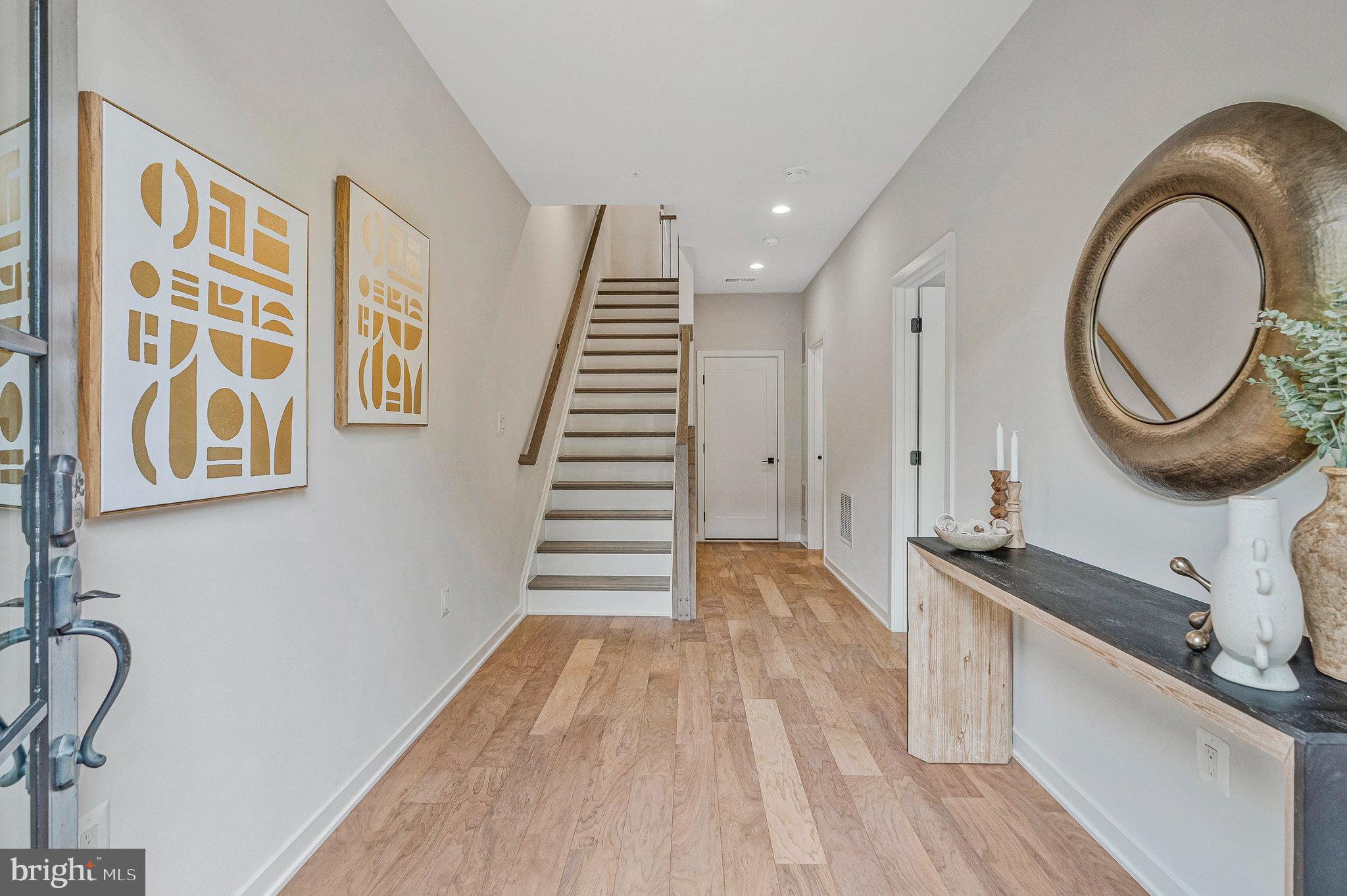 11724 Paysons Way Reston, VA 20191 - Photo 3 of 41 a view of a room with wooden floor and white walls