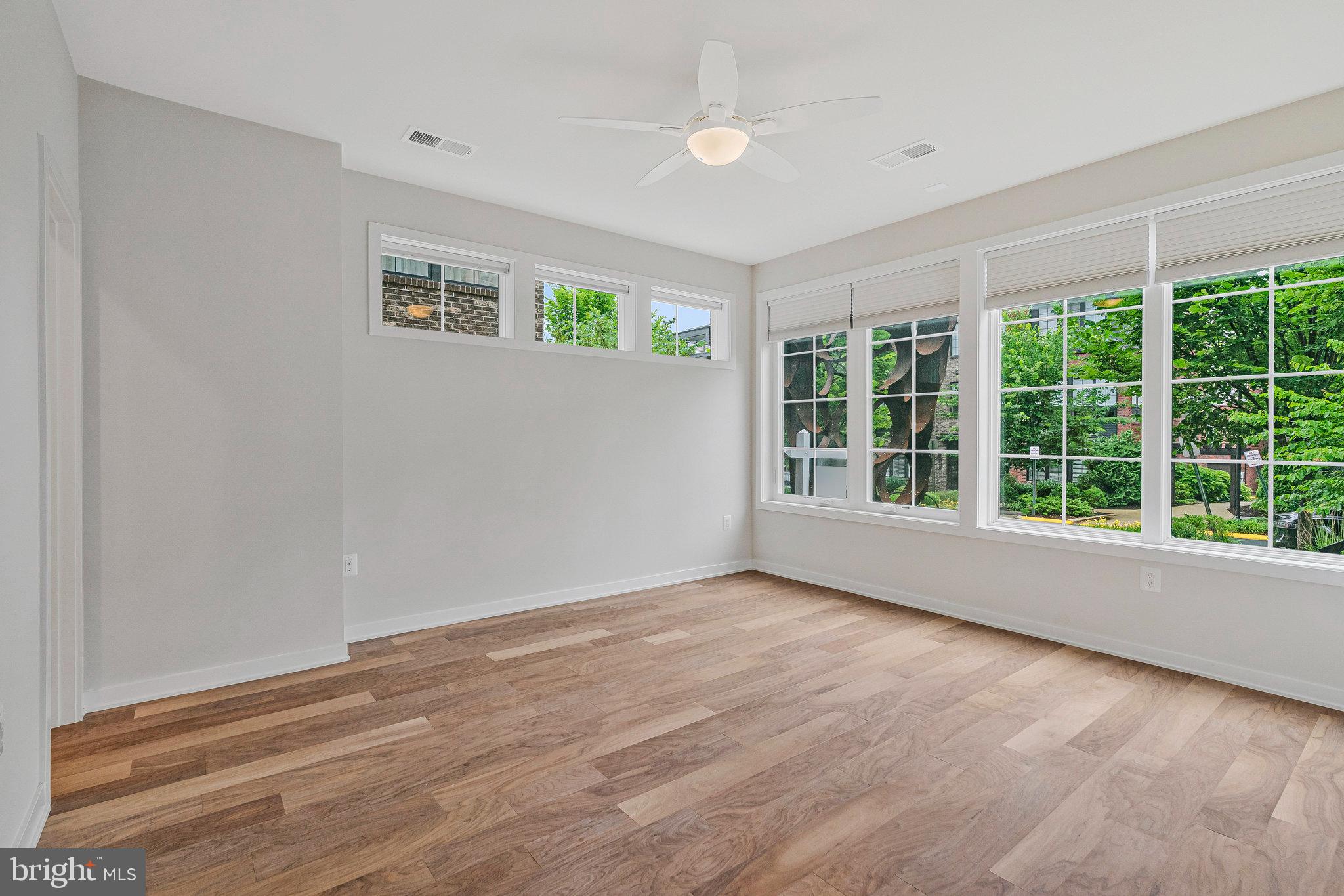 11724 Paysons Way Reston, VA 20191 - Photo 5 of 41 a view of an empty room with wooden floor and a window