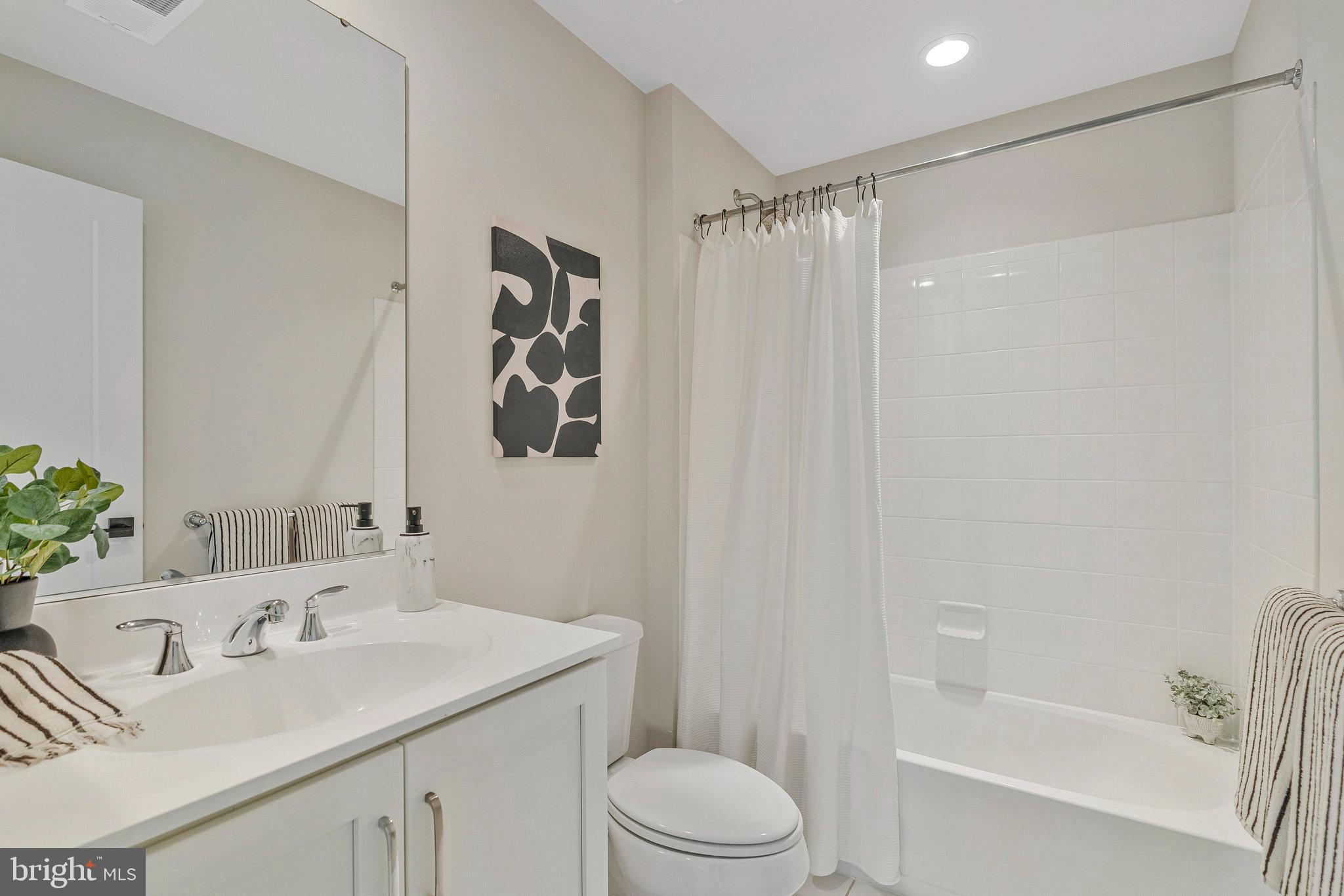 11724 Paysons Way Reston, VA 20191 - Photo 6 of 41 a bathroom with a sink toilet and shower