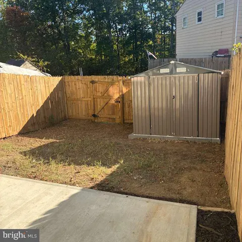 an empty room with closet and windows