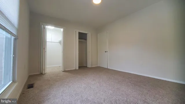 a bathroom with a sink toilet and a mirror