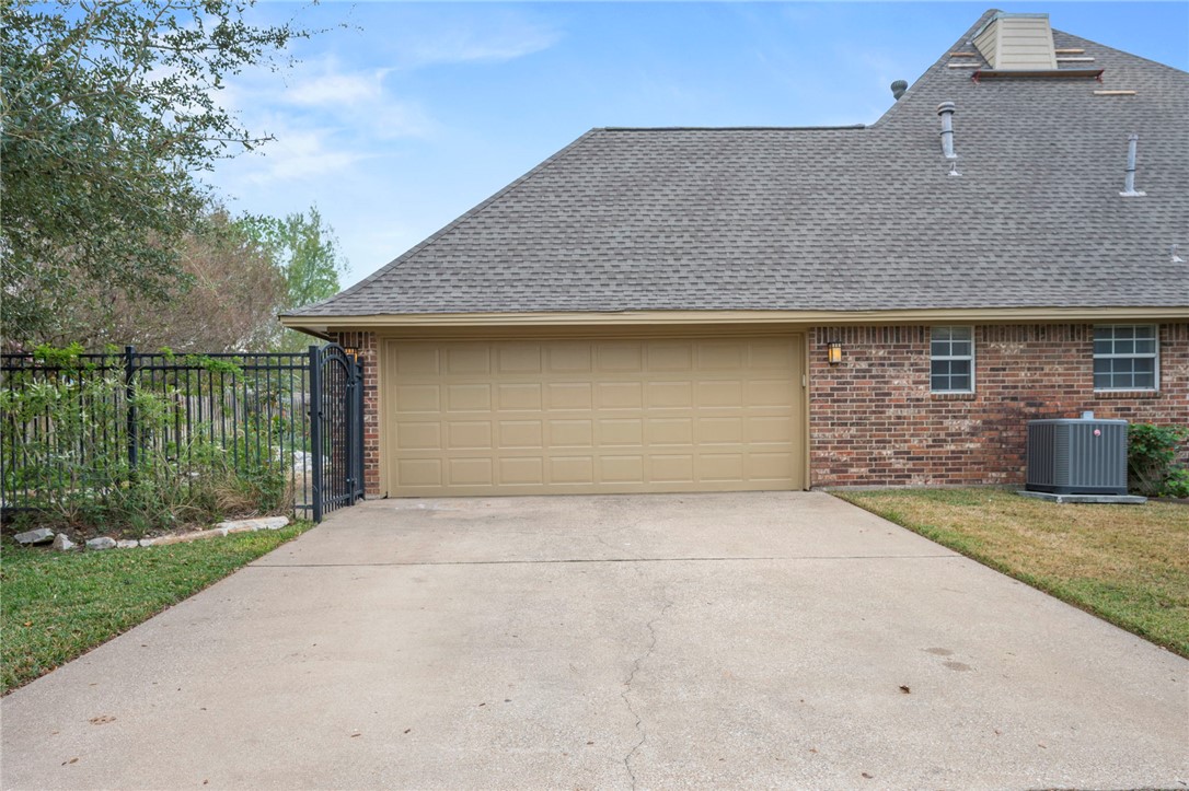 713 Willow Loop College Station, TX 77845 - Photo 39 of 39 a front view of a house with a garden and garage