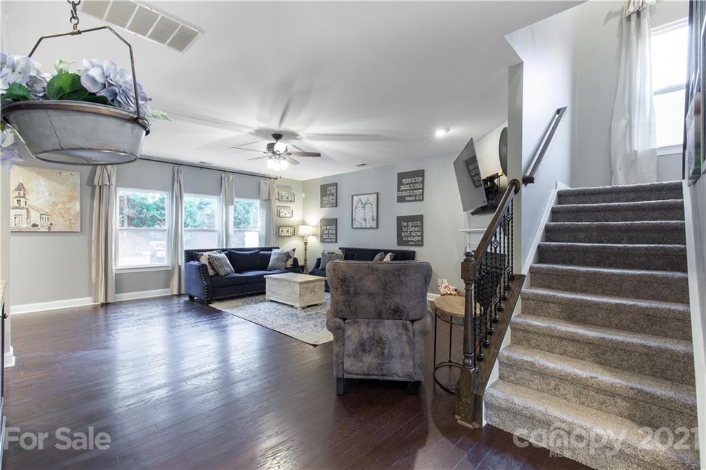 86512 Arrington Road Lancaster, SC 29720 - Photo 11 of 31 a living room with furniture and a chandelier