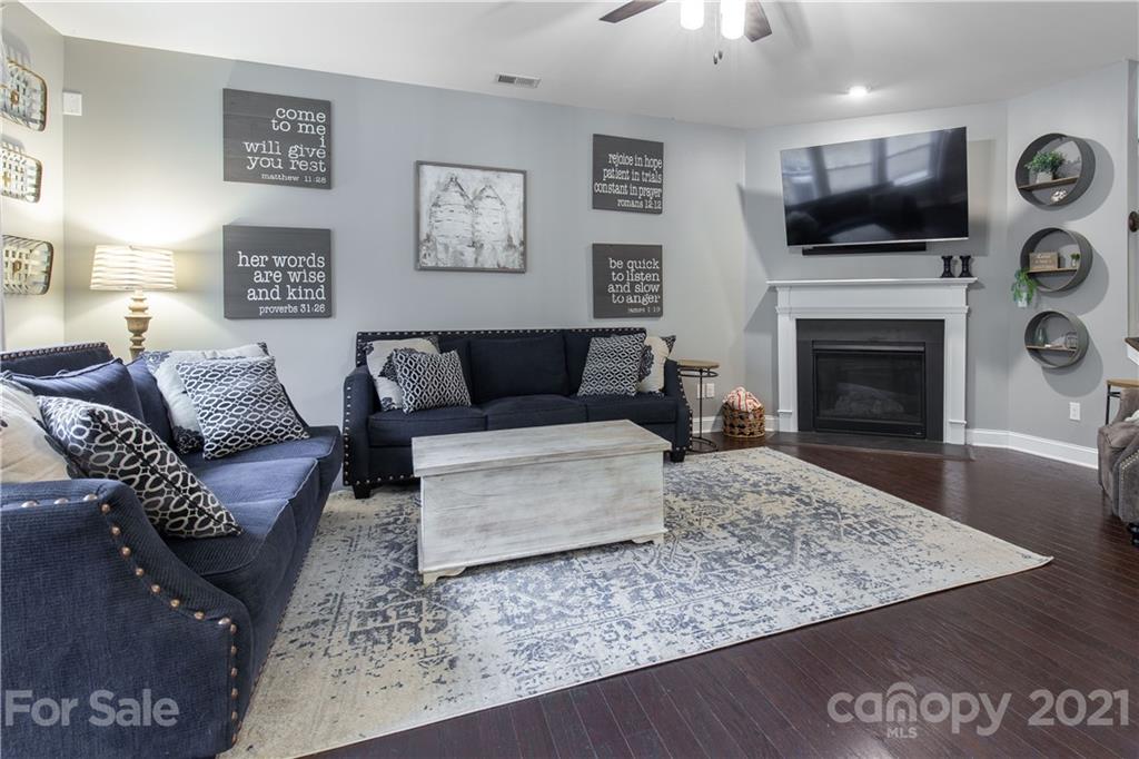 86512 Arrington Road Lancaster, SC 29720 - Photo 12 of 31 a living room with furniture a flat screen tv and a fireplace