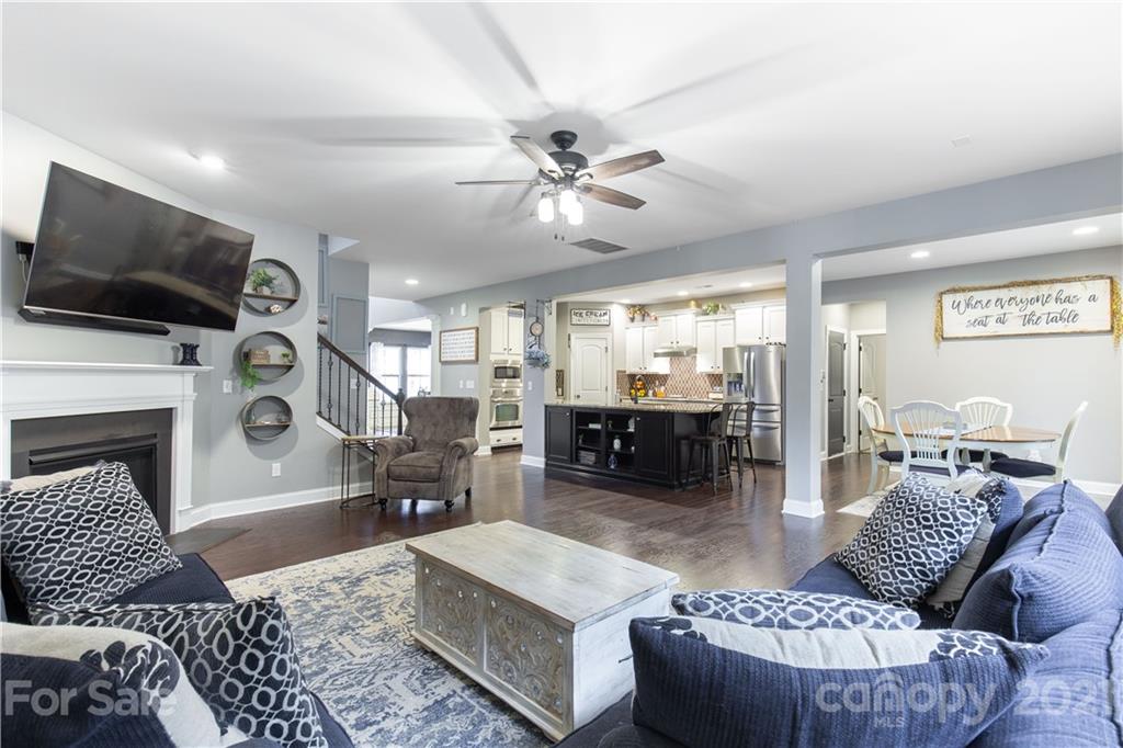 86512 Arrington Road Lancaster, SC 29720 - Photo 13 of 31 a living room with furniture a flat screen tv and kitchen view