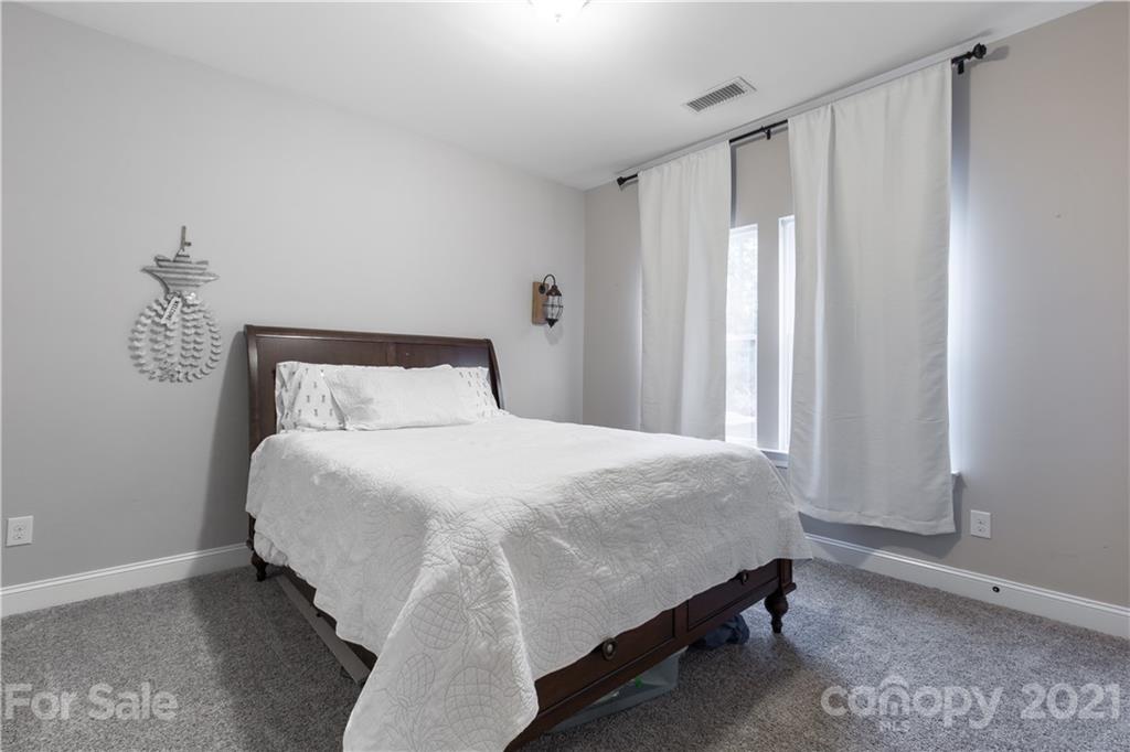 86512 Arrington Road Lancaster, SC 29720 - Photo 16 of 31 a bedroom with a bed and window