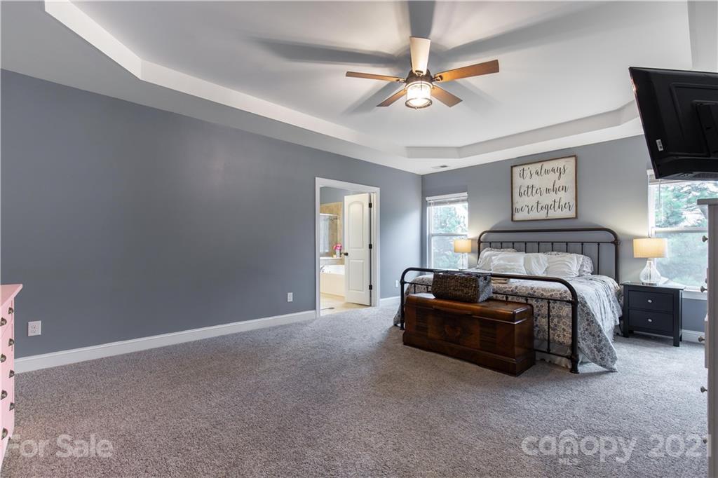 86512 Arrington Road Lancaster, SC 29720 - Photo 24 of 31 a spacious bedroom with a bed and a ceiling fan