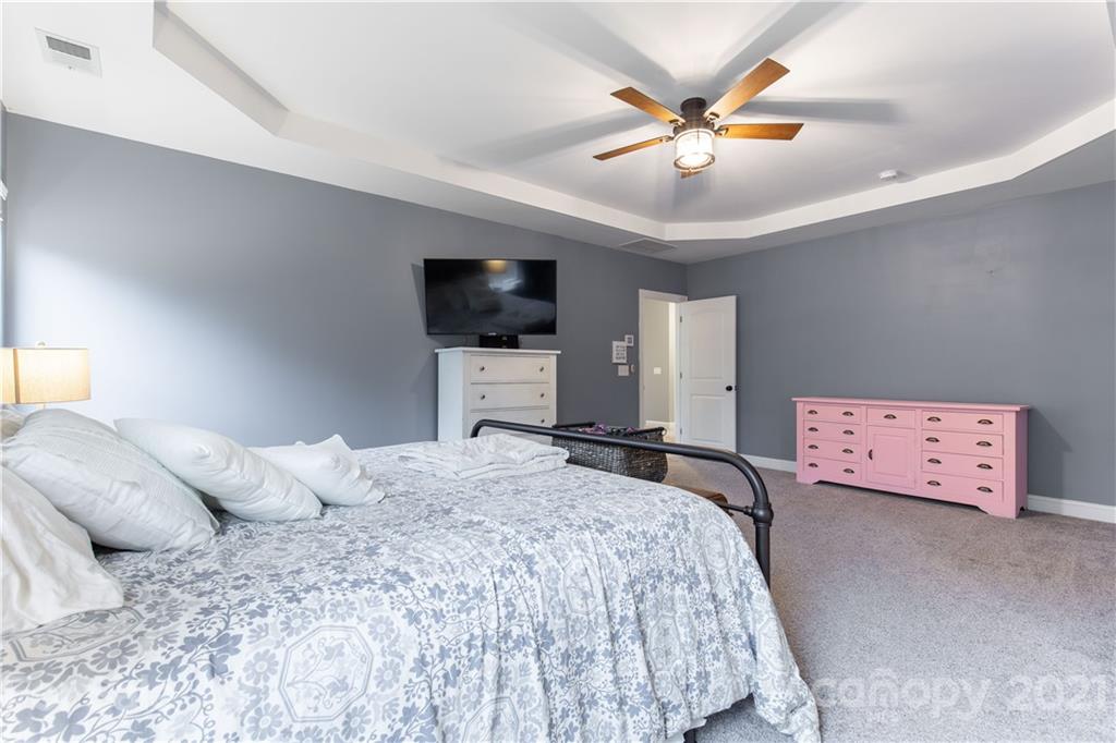 86512 Arrington Road Lancaster, SC 29720 - Photo 26 of 31 a bedroom with a bed and a flat screen tv