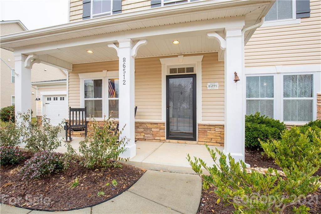 86512 Arrington Road Lancaster, SC 29720 - Photo 4 of 31 a view of a house with a flower garden