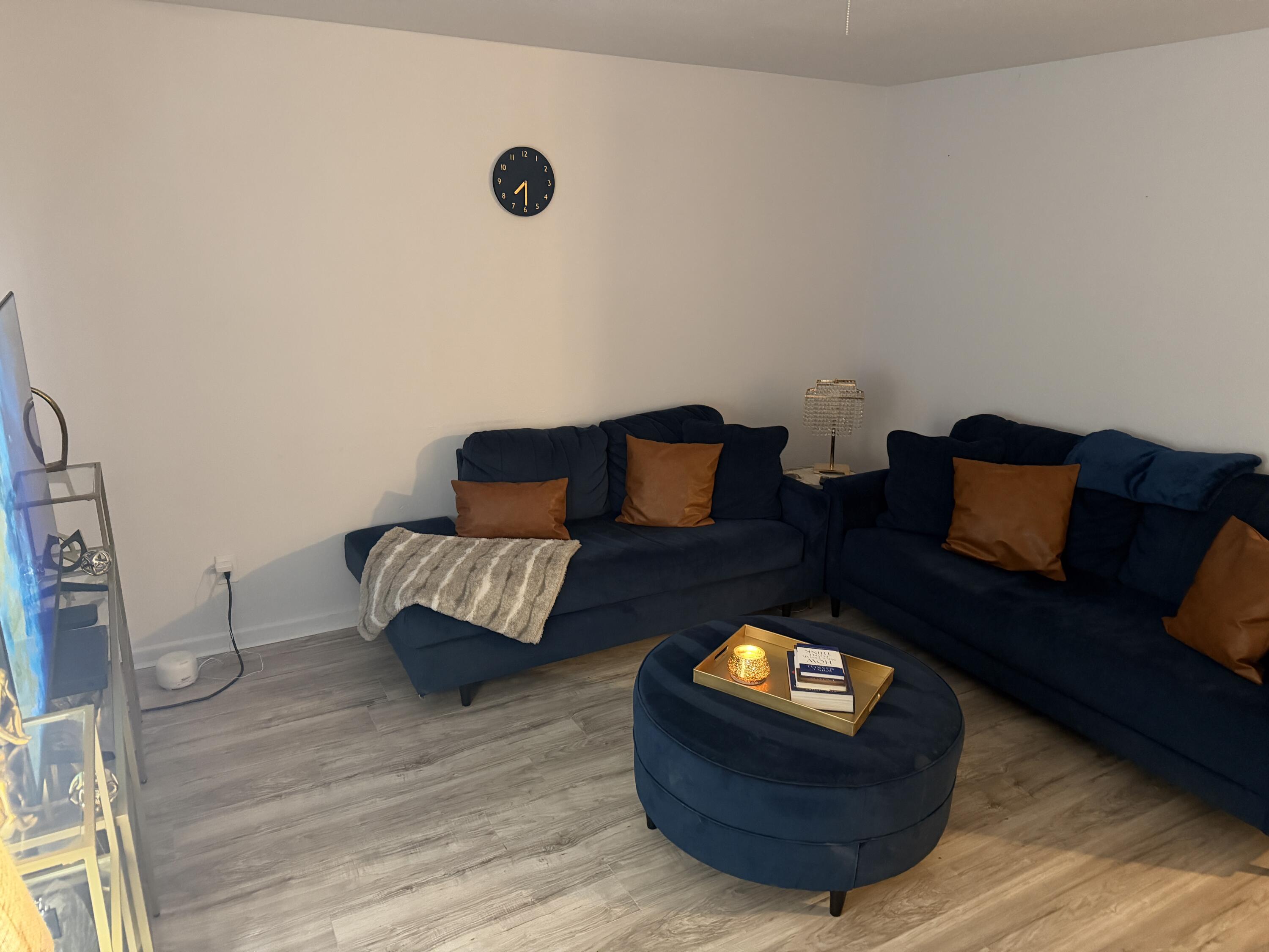 5110 46th Street Lubbock, TX 79414 - Photo 2 of 10 a living room with furniture and a wooden floor