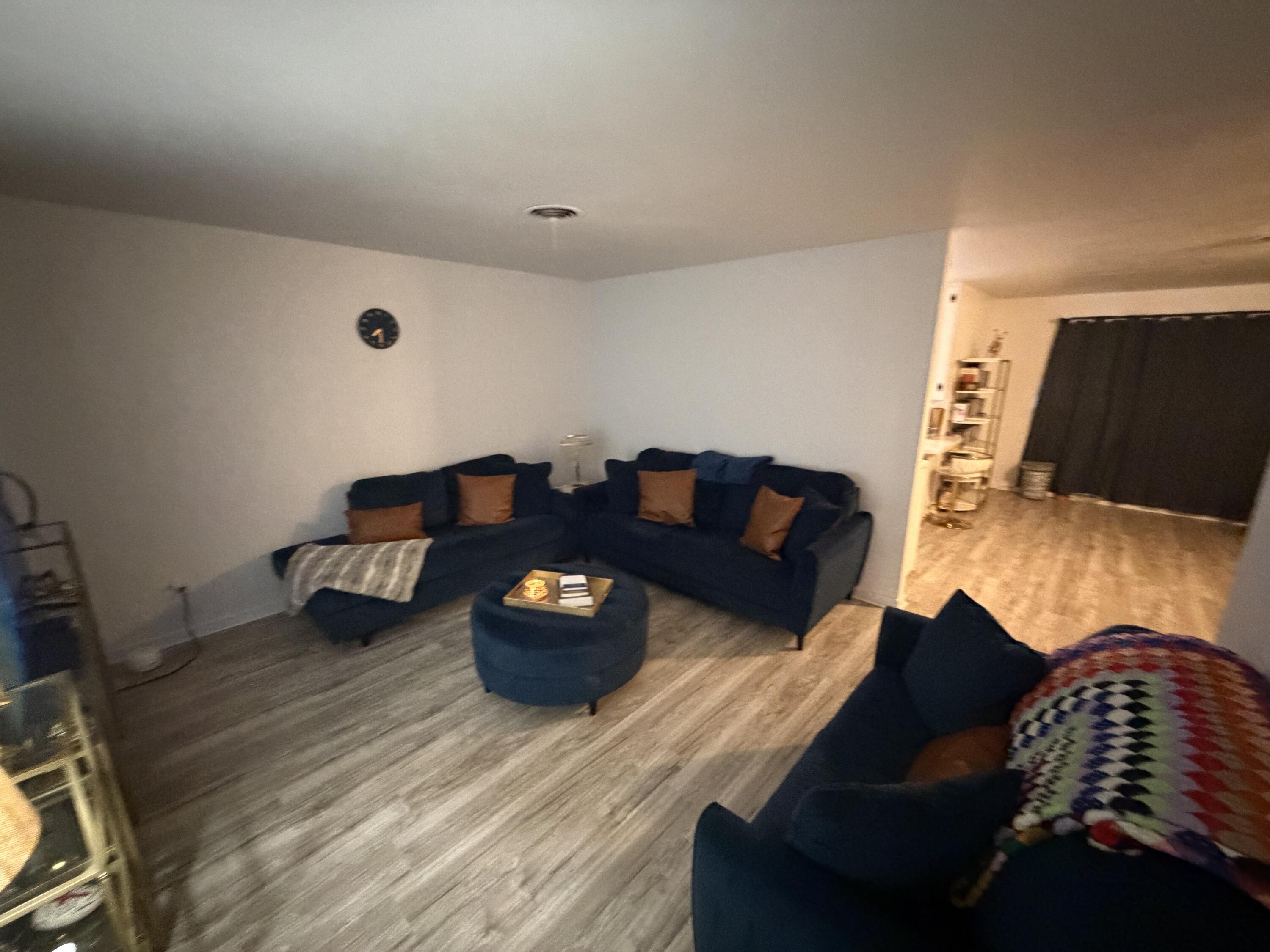 5110 46th Street Lubbock, TX 79414 - Photo 3 of 10 a living room with furniture and a flat screen tv