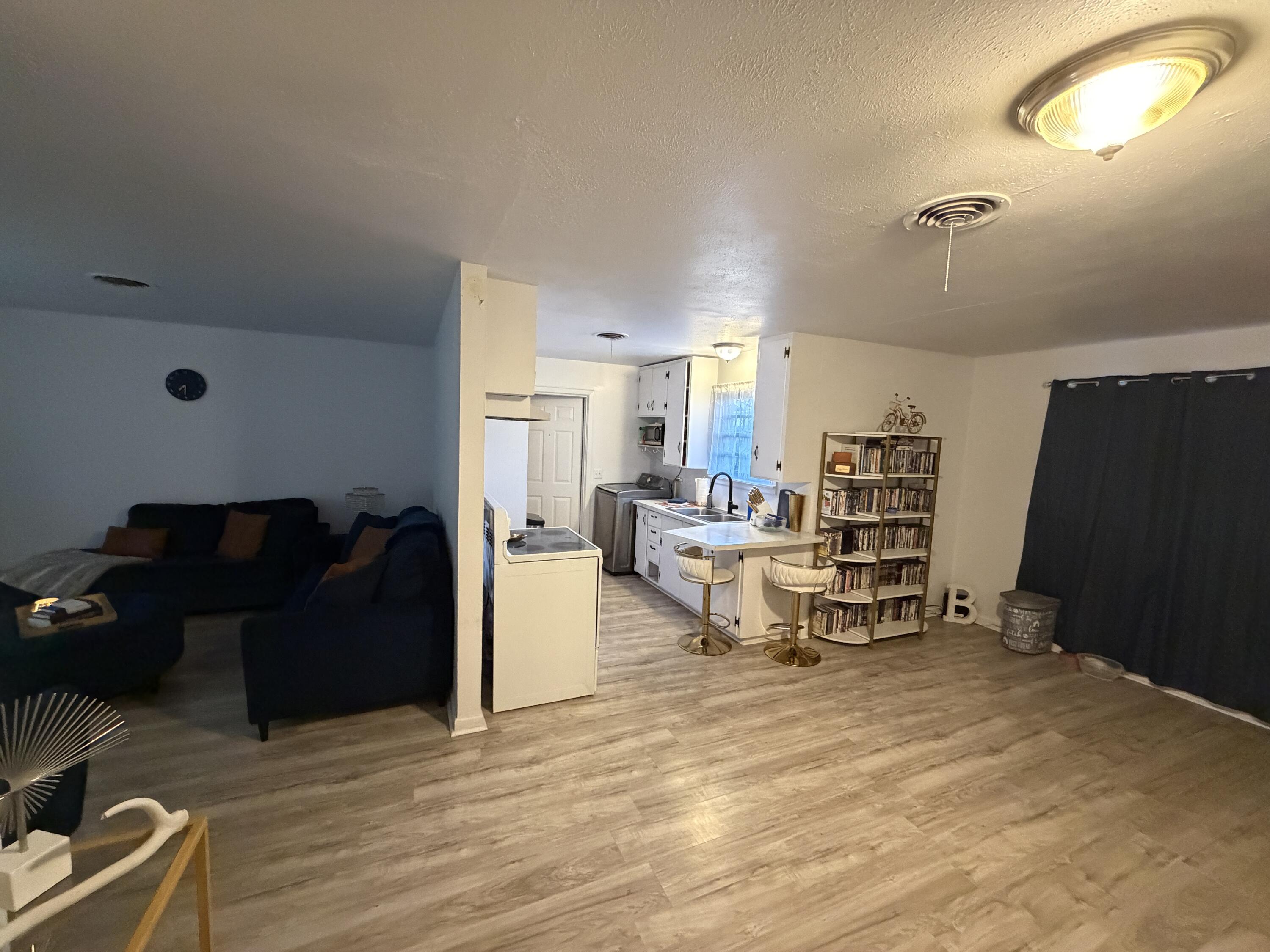 5110 46th Street Lubbock, TX 79414 - Photo 4 of 10 a living room with furniture and a wooden floor