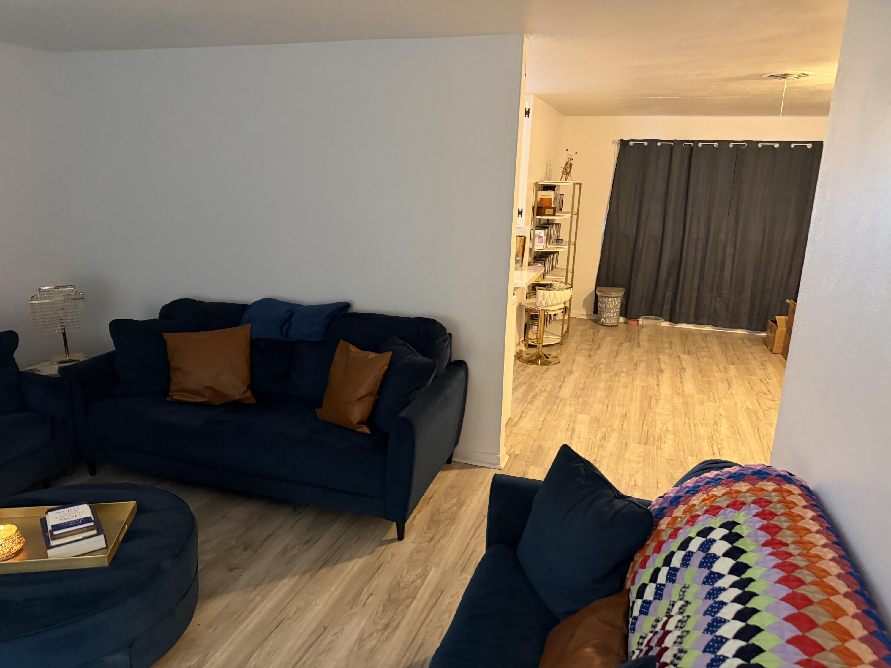 5110 46th Street Lubbock, TX 79414 - Photo 6 of 10 a living room with furniture and a lamp