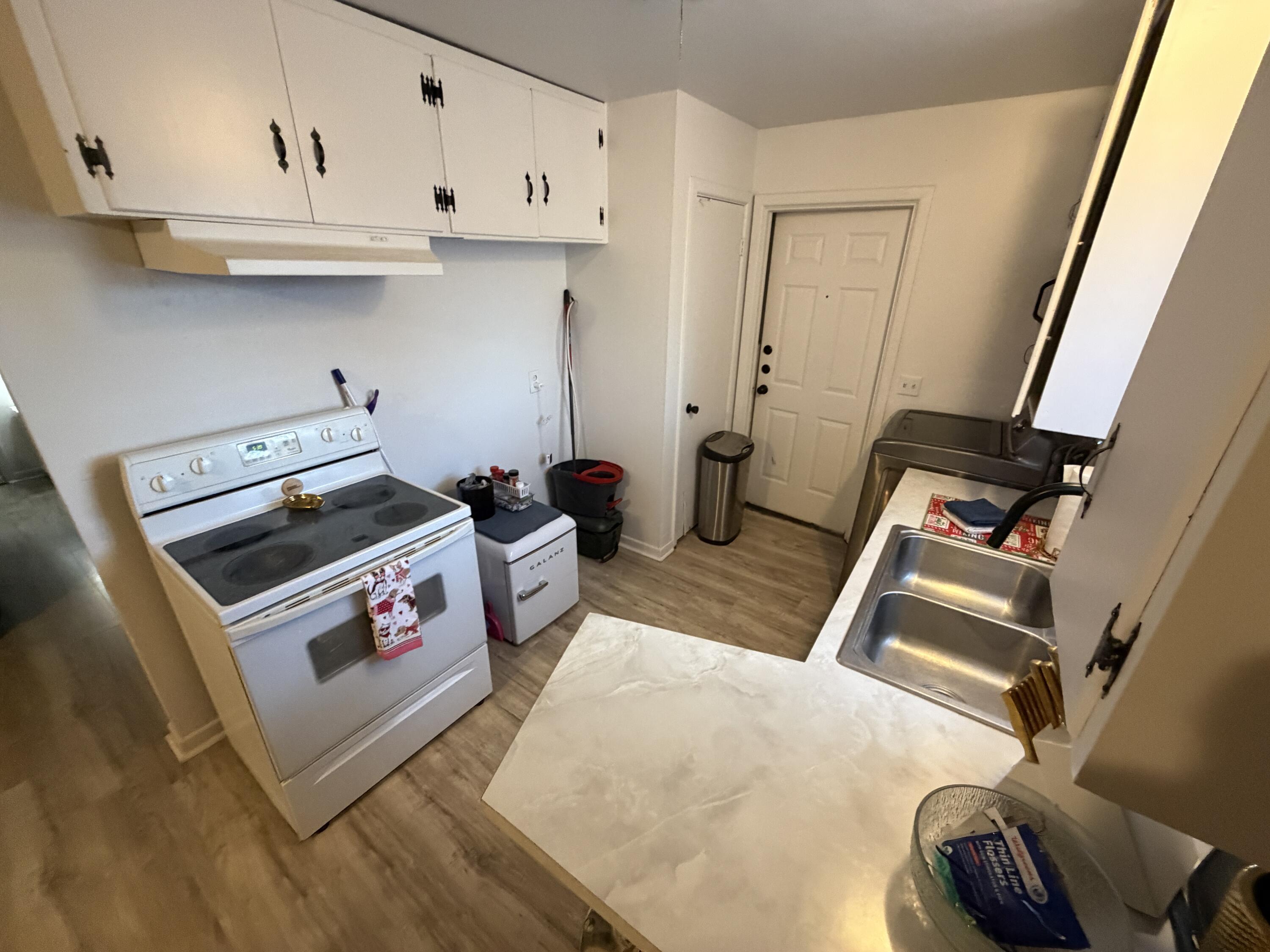 5110 46th Street Lubbock, TX 79414 - Photo 7 of 10 a utility room with dryer and washer