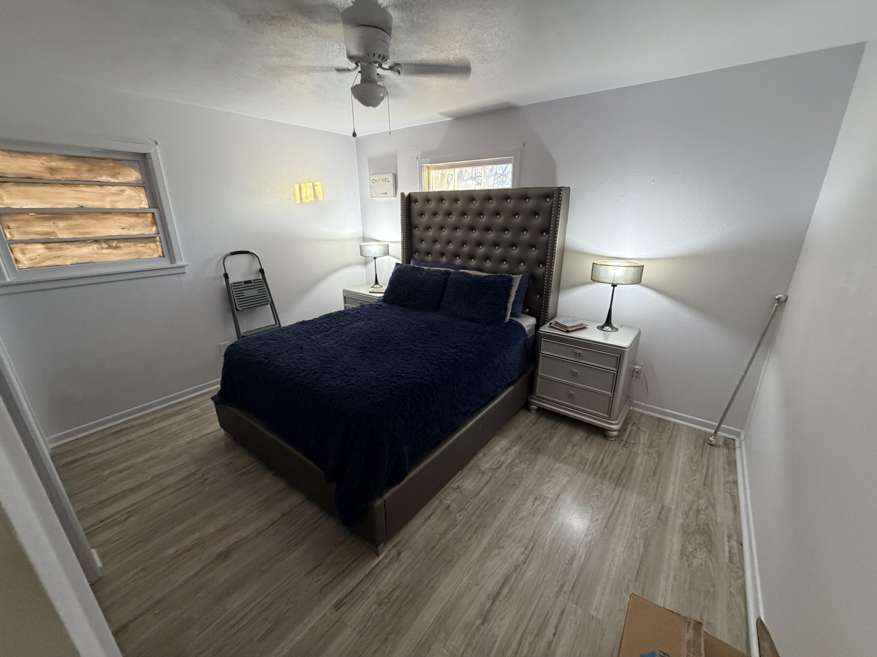 5110 46th Street Lubbock, TX 79414 - Photo 8 of 10 a living room with a bed furniture and a window