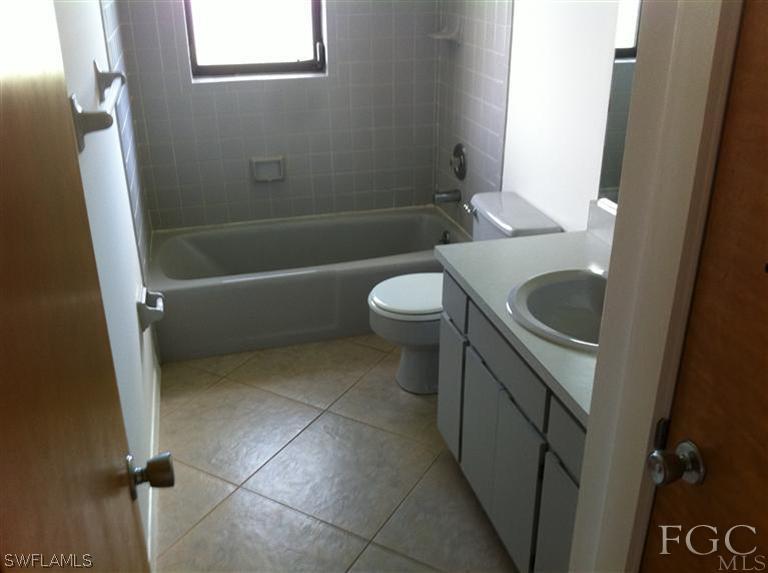 17432 Lebanon Road Fort Myers, FL 33967 - Photo 6 of 20 a bathroom with a sink a toilet and bathtub