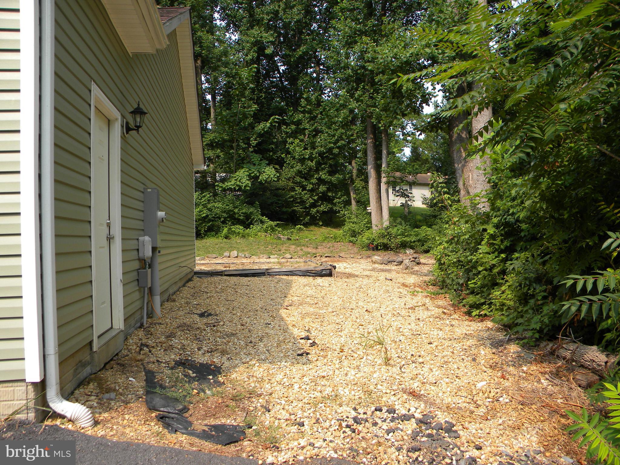 186 Highridge Road Front Royal, VA 22630 - Photo 54 of 59 side yard off garage to park boat or Rv/camper