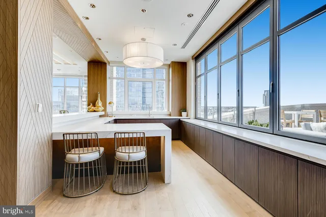 a kitchen with table and chairs