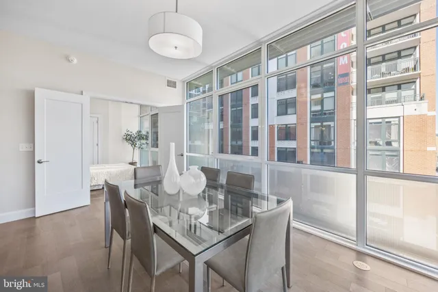 a view of a dining room with furniture window and wooden floor