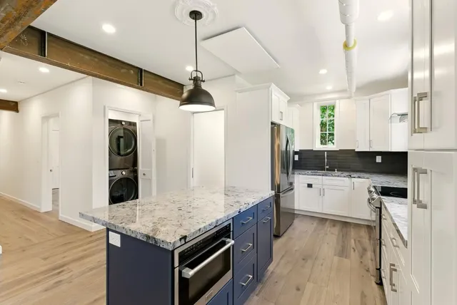 a kitchen with a stove and a sink