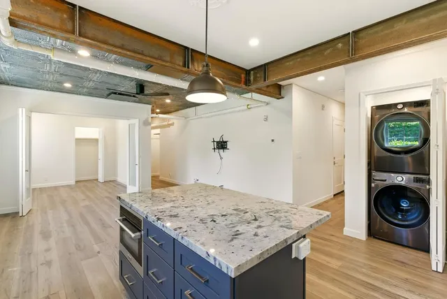 a view of a kitchen cabinets and wooden floor