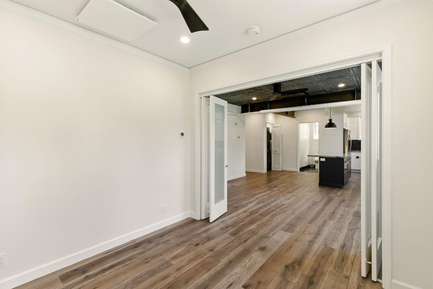 212 Eaton Road, Unit 1 San Mateo, CA 94402 - Photo 7 of 14 a view of a big room with wooden floor and entryway