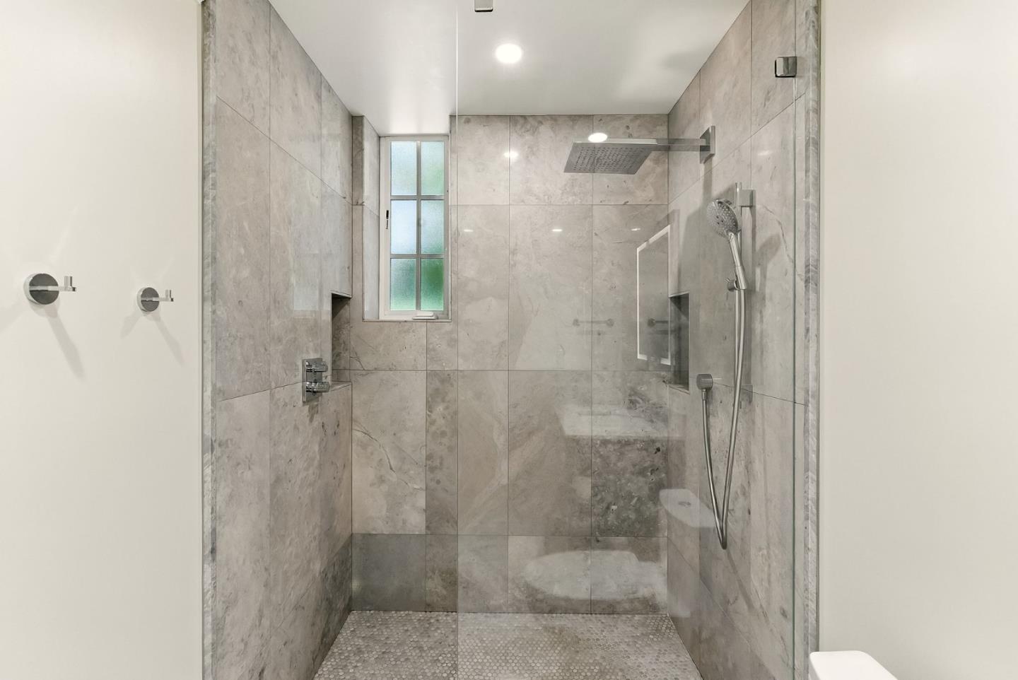 212 Eaton Road, Unit 1 San Mateo, CA 94402 - Photo 8 of 14 a bathroom with a glass shower door