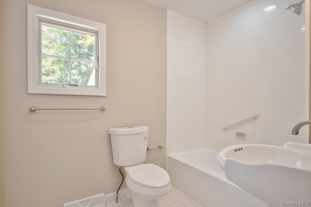 151 Airport Road Bethel, NY 12762 - Photo 14 of 19 a white toilet sitting next to a bath tub