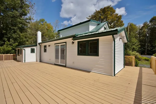 a front view of a house with parking area