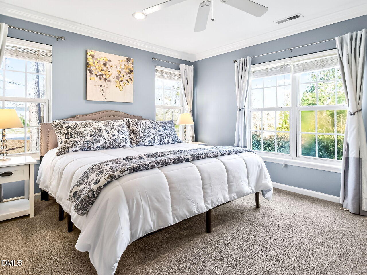 422 Intern Way Durham, NC 27713 - Photo 18 of 33 a bed sitting in a bedroom next to a window