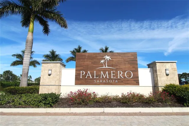 a view of a swimming pool with outdoor seating and plants
