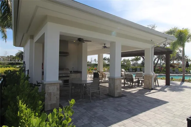 a view of backyard of house with outdoor seating
