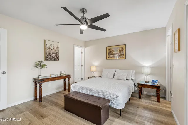 a bedroom with a large bed and a window