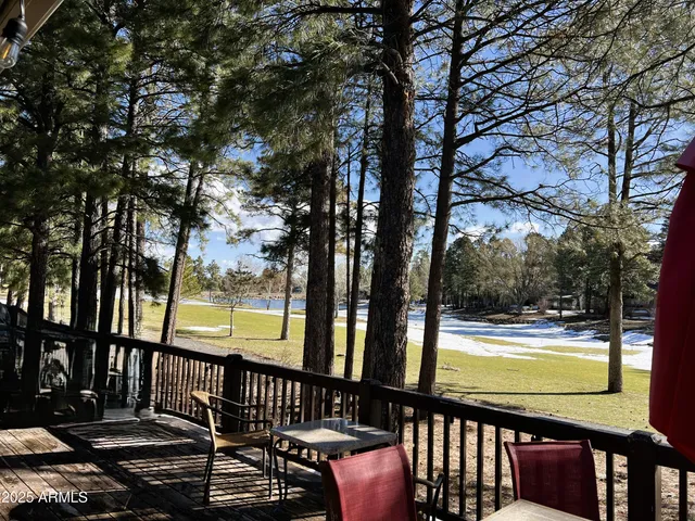 a view of a swimming pool with an outdoor seating