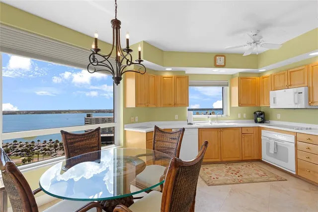a kitchen with a table and chairs in it