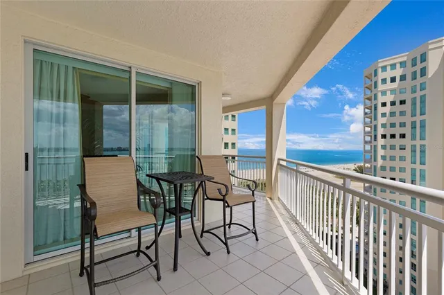 a view of a balcony with chairs