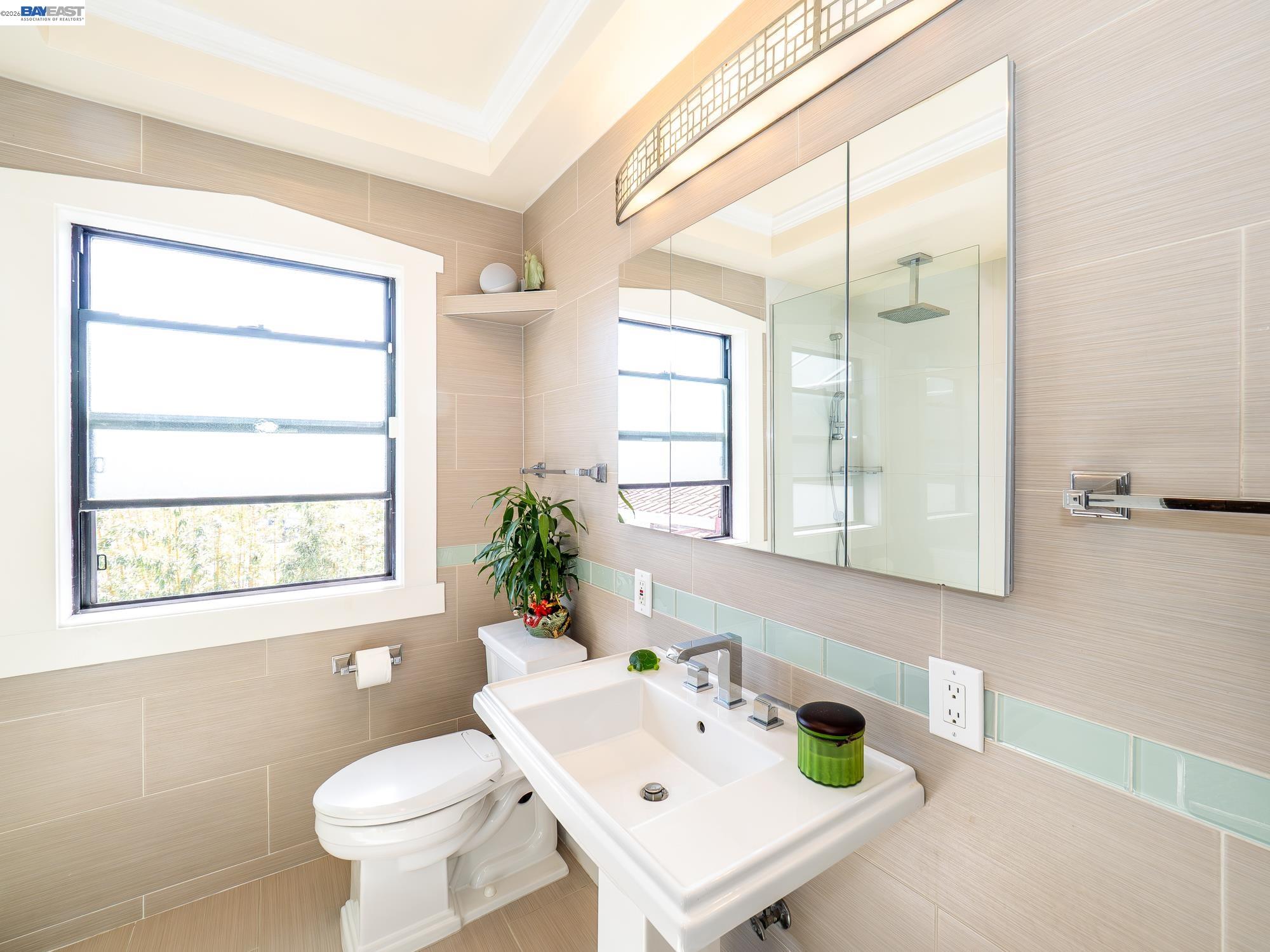 22111 Prospect Street Hayward, CA 94541 - Photo 34 of 70 a bathroom with a sink a toilet and a mirror