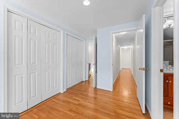 a bedroom with a bed and a ceiling fan
