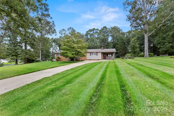 a house view with a sitting space and garden view