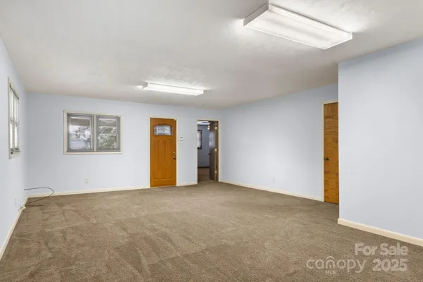 a view of an empty room with a window