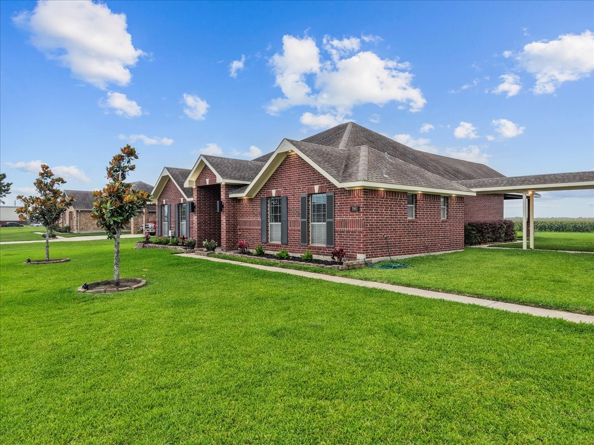 3911 Palm Crest Drive Rosharon, TX 77583 - Photo 2 of 47 Home and breezeway to garage